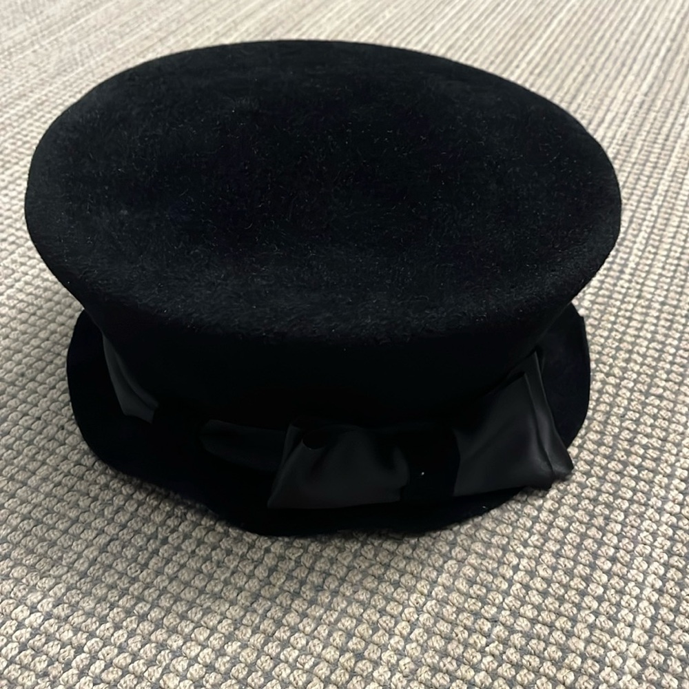 Black Felt hat with satin bow around crown and ruffled brim